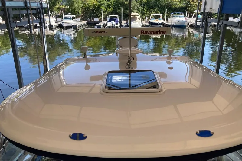 Slide: The Image of 2008 Sea Ray 44 Sundancer yacht docked, featuring Raymarine equipment and sleek design. - 17
