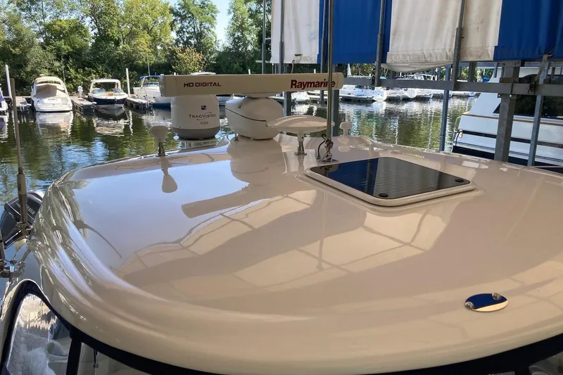 Slide: The Image of 2008 Sea Ray 44 Sundancer yacht with Raymarine equipment docked at marina. - 18