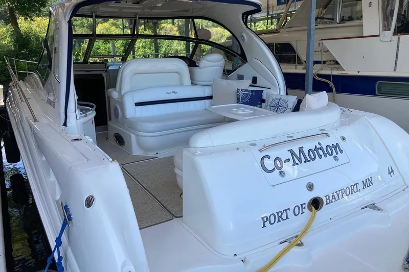 Slide: The Image of 2008 Sea Ray 44 Sundancer yacht docked, featuring spacious seating and elegant design. - 23