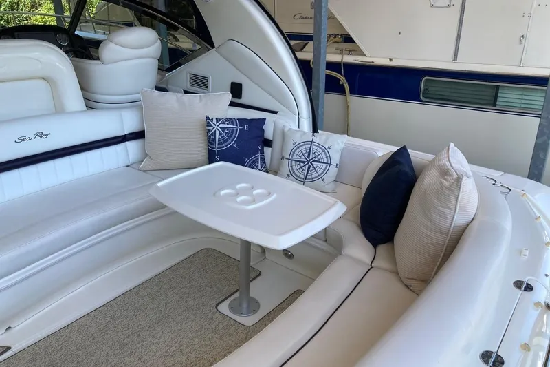 Slide: The Image of Luxurious 2008 Sea Ray 44 Sundancer yacht interior with plush seating and nautical-themed pillows. - 24