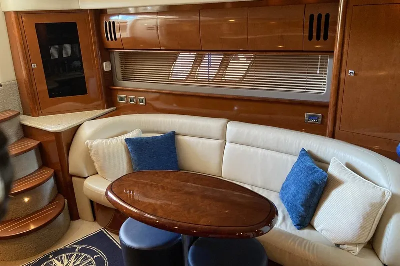 Slide: The Image of Luxurious 2008 Sea Ray 44 Sundancer yacht interior with plush seating and elegant wood finishes. - 34