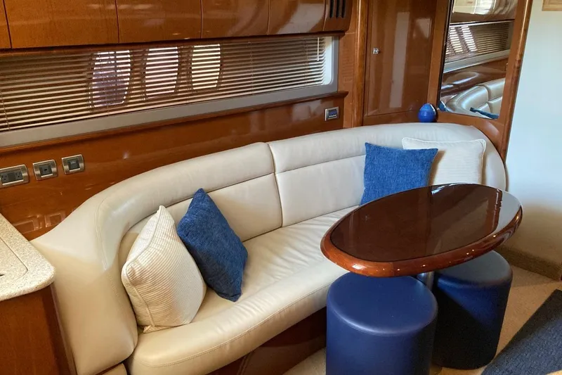 Slide: The Image of Luxurious interior of 2008 Sea Ray 44 Sundancer yacht with elegant seating and table. - 35