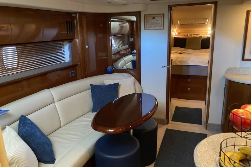 Slide: The Image of Luxurious interior of 2008 Sea Ray 44 Sundancer yacht with elegant seating and cozy bedroom. - 36
