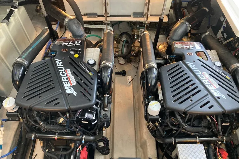 Slide: The Image of Engine room of a 2008 Sea Ray 44 Sundancer with twin Mercury engines. - 49