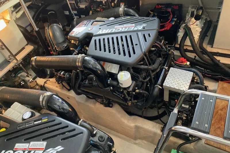 Slide: The Image of Engine room of a 2008 Sea Ray 44 Sundancer with Mercury engines and various components. - 51
