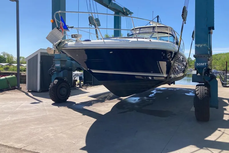 Slide: The Image of 2008 Sea Ray 44 Sundancer yacht lifted by crane at marina. - 53
