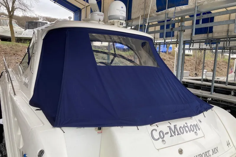 Slide: The Image of 2008 Sea Ray 44 Sundancer yacht with blue canvas cover in marina. - 7