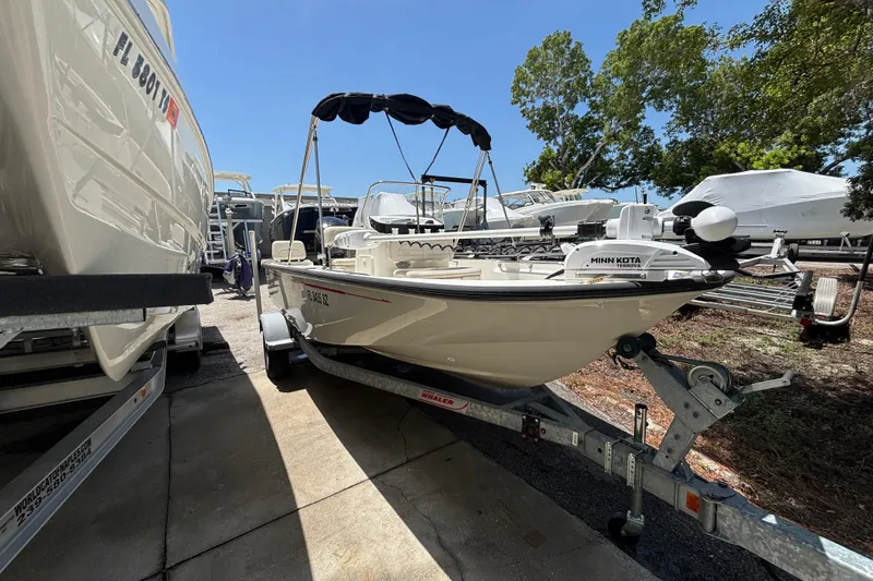 The Image of 2021 Boston Whaler 170 Montauk boat on trailer, equipped with Minn Kota Terrova motor. - 0