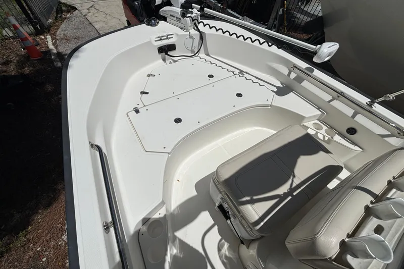 Slide: The Image of 2021 Boston Whaler 170 Montauk boat interior with seating and storage compartments. - 3