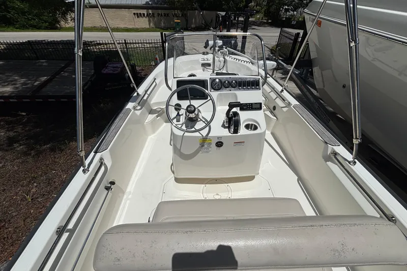 Slide: The Image of 2021 Boston Whaler 170 Montauk boat interior with steering console and seating. - 4