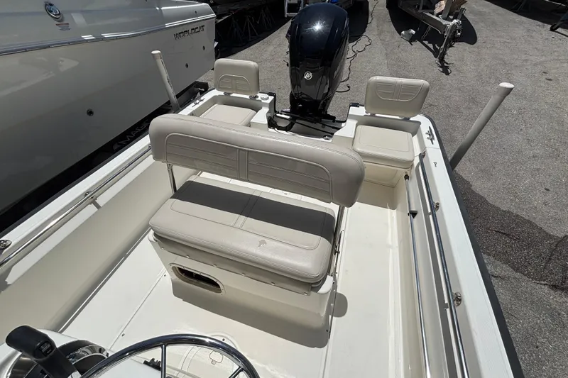 Slide: The Image of 2021 Boston Whaler 170 Montauk boat interior with seating and motor. - 5