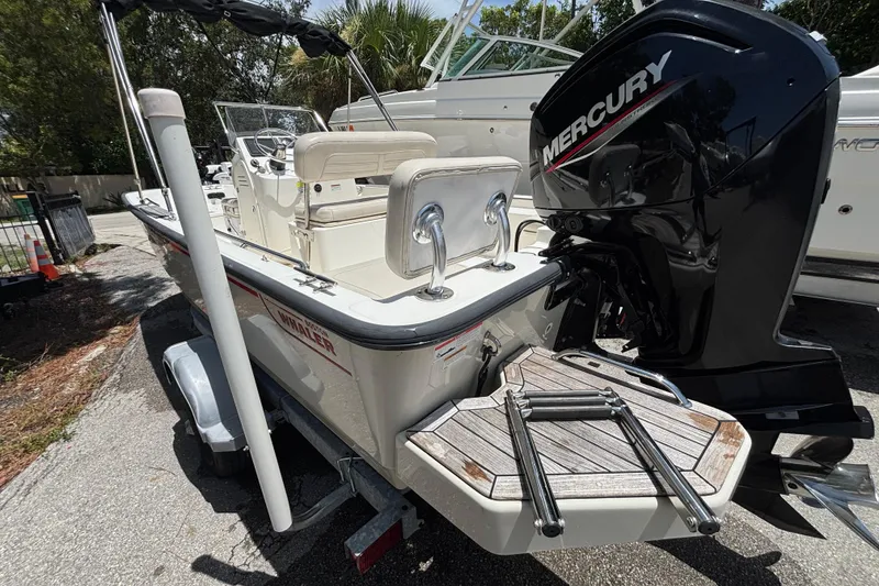 Slide: The Image of 2021 Boston Whaler 170 Montauk boat with Mercury engine on trailer. - 7