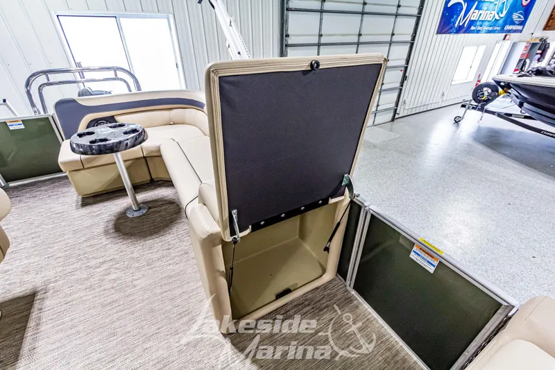 Slide: The Image of 2025 Godfrey Sweetwater 2286 C pontoon boat interior with storage compartment open. - 15