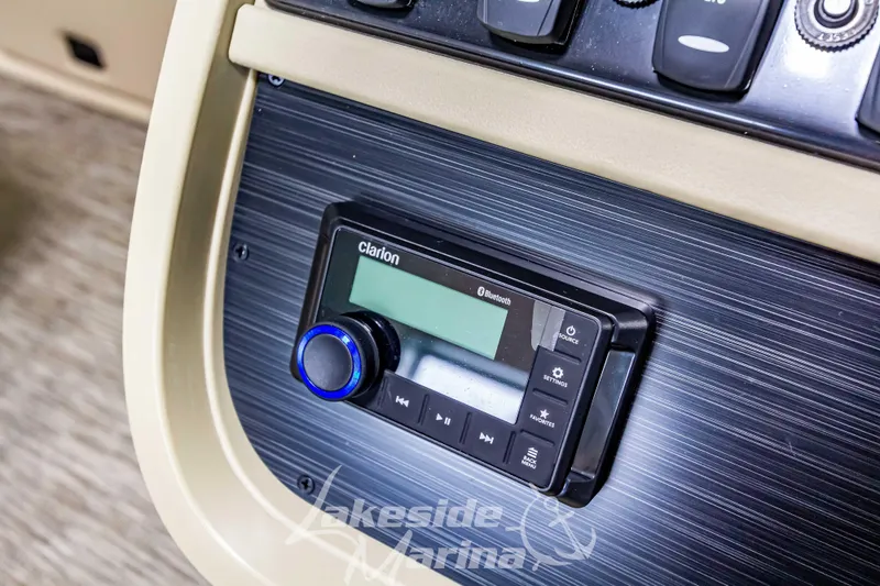 Slide: The Image of Clarion audio system on 2025 Godfrey Sweetwater 2286 C boat dashboard. - 22
