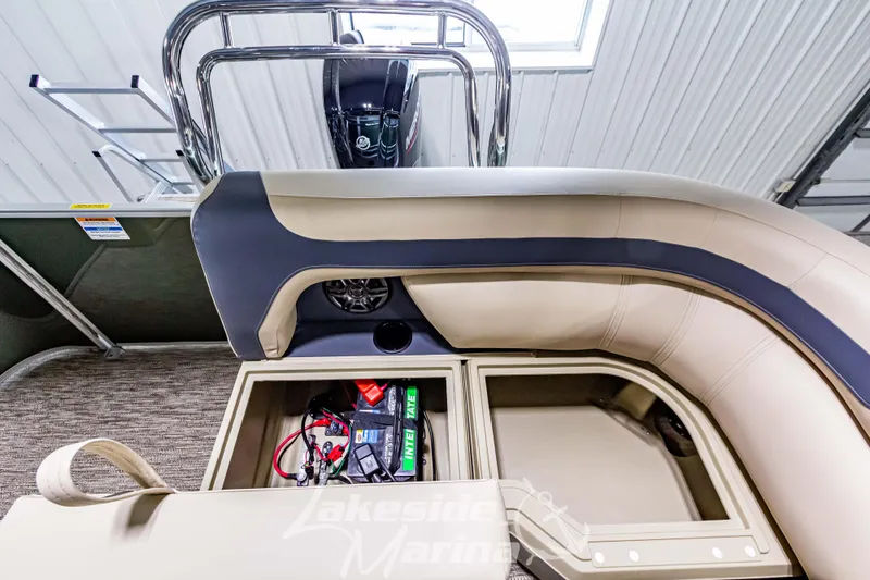 Slide: The Image of 2025 Godfrey Sweetwater 2286 C pontoon boat interior with storage compartments and seating. - 25