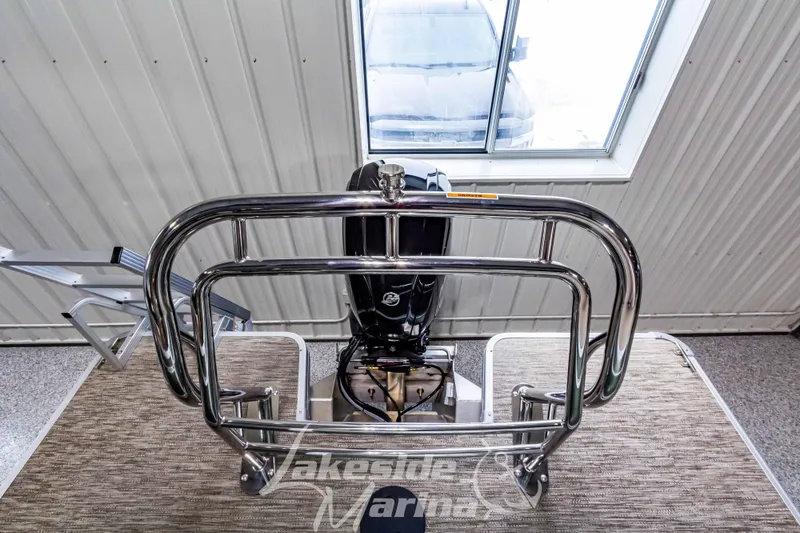 Slide: The Image of 2025 Godfrey Sweetwater 2286 C boat engine and railing in showroom. - 28