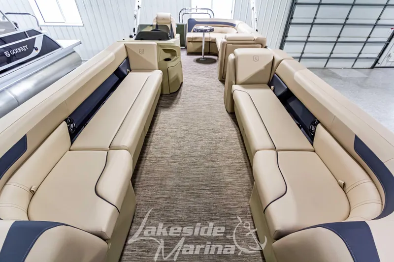 Slide: The Image of 2025 Godfrey Sweetwater 2286 C pontoon boat interior with beige seating. - 7