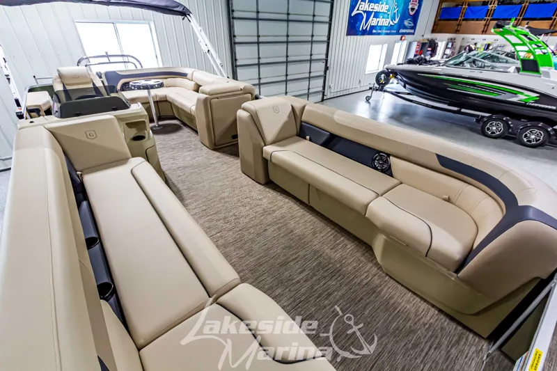 Slide: The Image of 2025 Godfrey Sweetwater 2286 C pontoon boat interior with luxurious seating and modern design. - 9