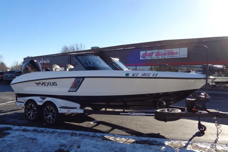Slide: The Image of 2021 Vexus DVX20 boat on trailer in parking lot, sunny day. - 11