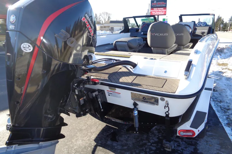 Slide: The Image of 2021 Vexus DVX20 boat with powerful Mercury 300 engine, parked on snowy pavement. - 15