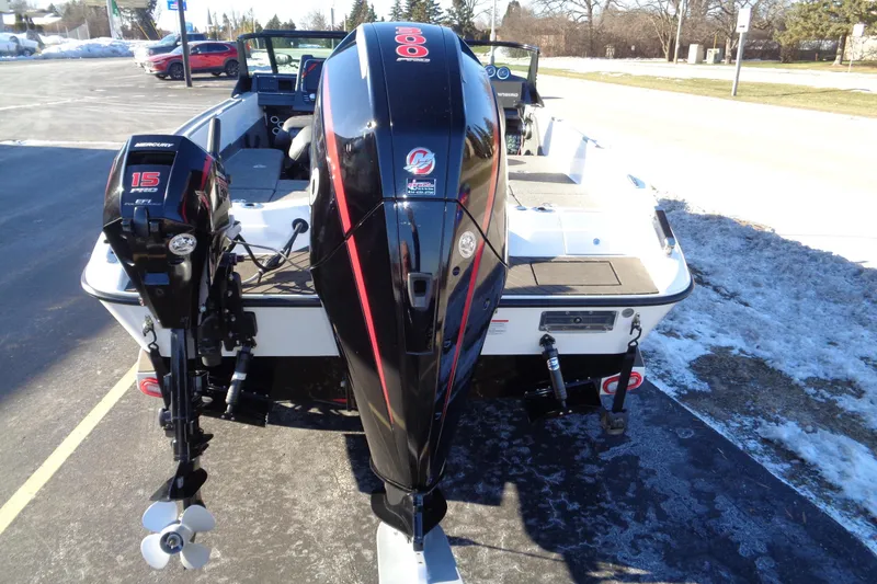 Slide: The Image of 2021 Vexus DVX20 boat with dual outboard motors in a snowy parking lot. - 17