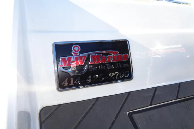 Slide: The Image of Plaque on 2021 Vexus DVX20 boat featuring M-W Marine contact details. - 19