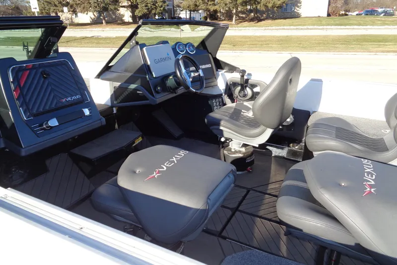 Slide: The Image of 2021 Vexus DVX20 boat interior with Garmin navigation and comfortable seating. - 21