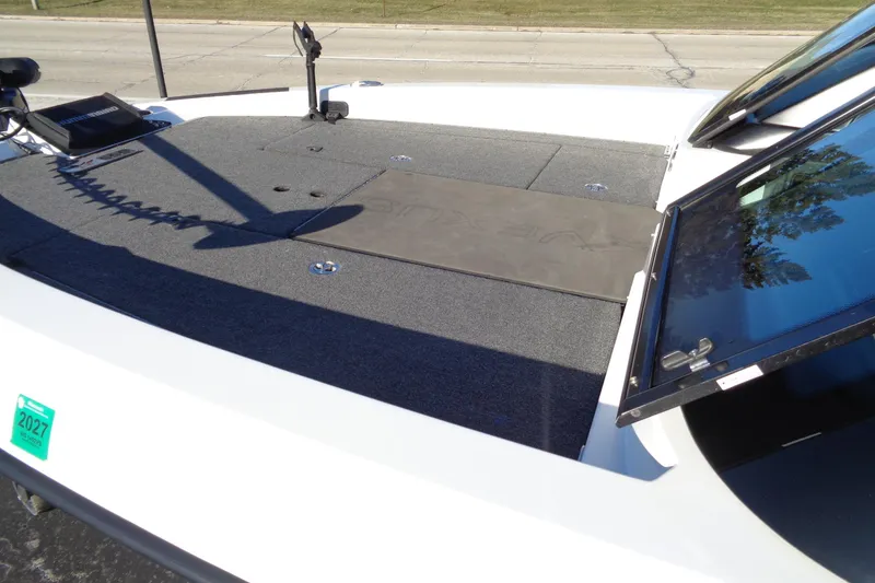 Slide: The Image of 2021 Vexus DVX20 boat deck with open storage compartments and trolling motor. - 22