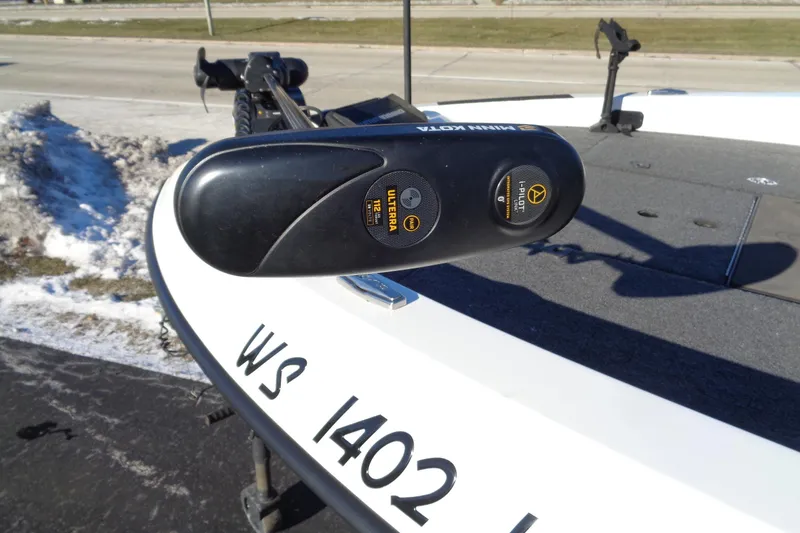 Slide: The Image of 2021 Vexus DVX20 boat with Minn Kota trolling motor on snowy pavement. - 23