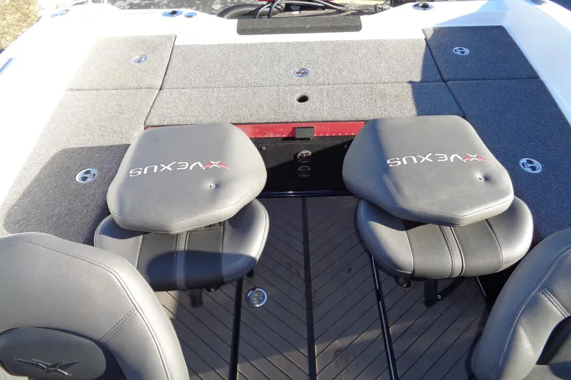 Slide: The Image of 2021 Vexus DVX20 boat interior with gray seating and carpeted deck. - 26