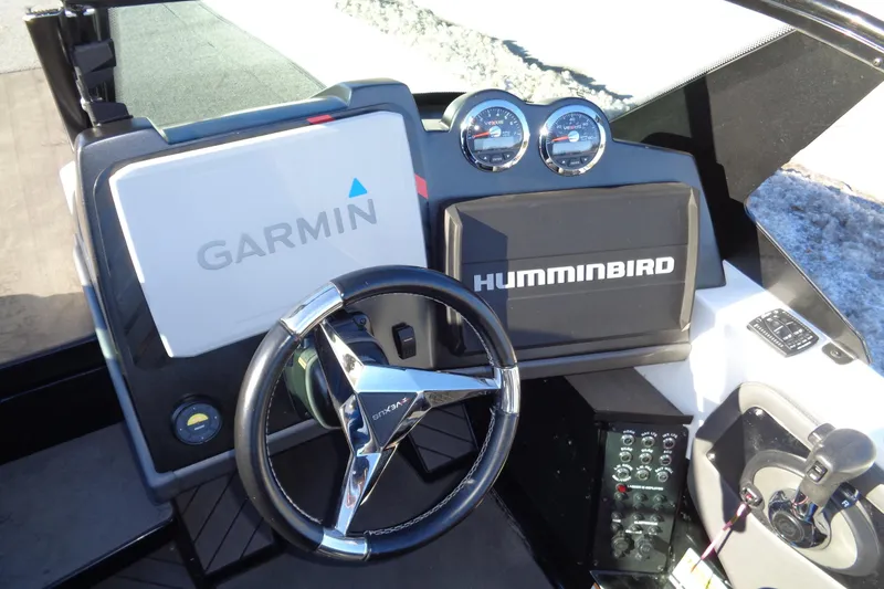 Slide: The Image of 2021 Vexus DVX20 boat dashboard with Garmin and Humminbird displays. - 28