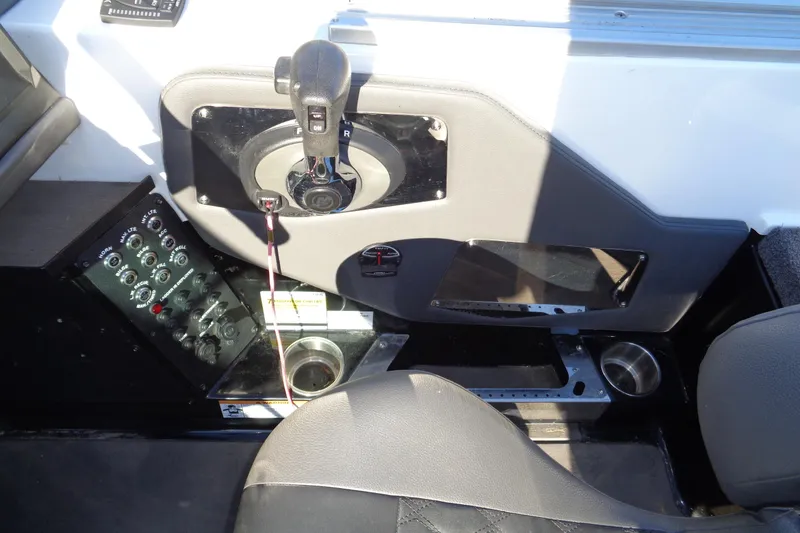 Slide: The Image of 2021 Vexus DVX20 boat interior with control panel and gear shift. - 29