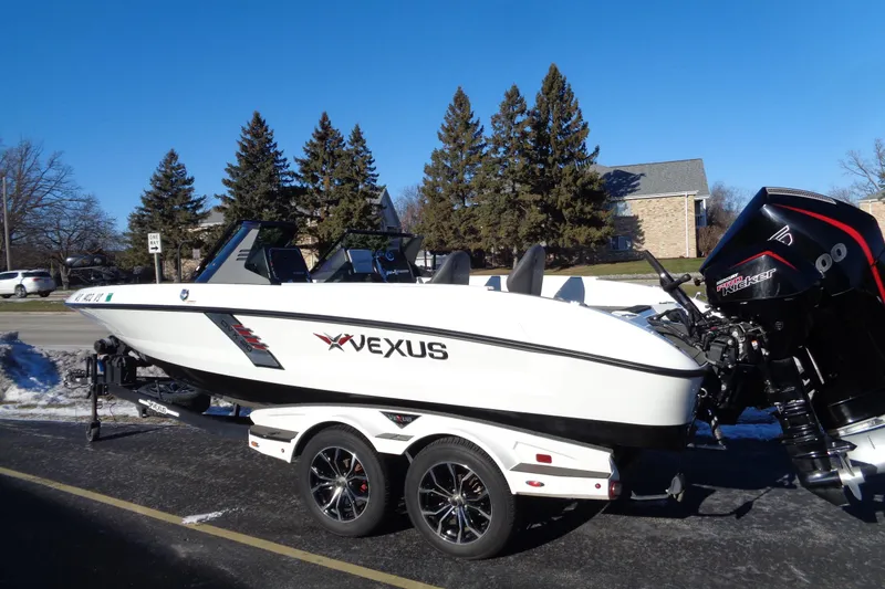 Slide: The Image of 2021 Vexus DVX20 boat on trailer, parked outdoors on a sunny day. - 3