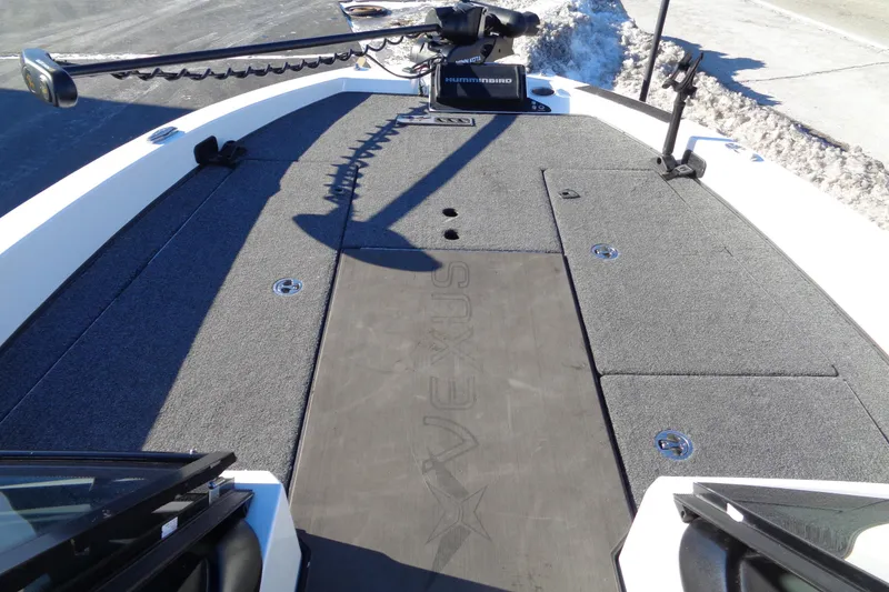 Slide: The Image of 2021 Vexus DVX20 boat deck with carpeted surface and trolling motor. - 31