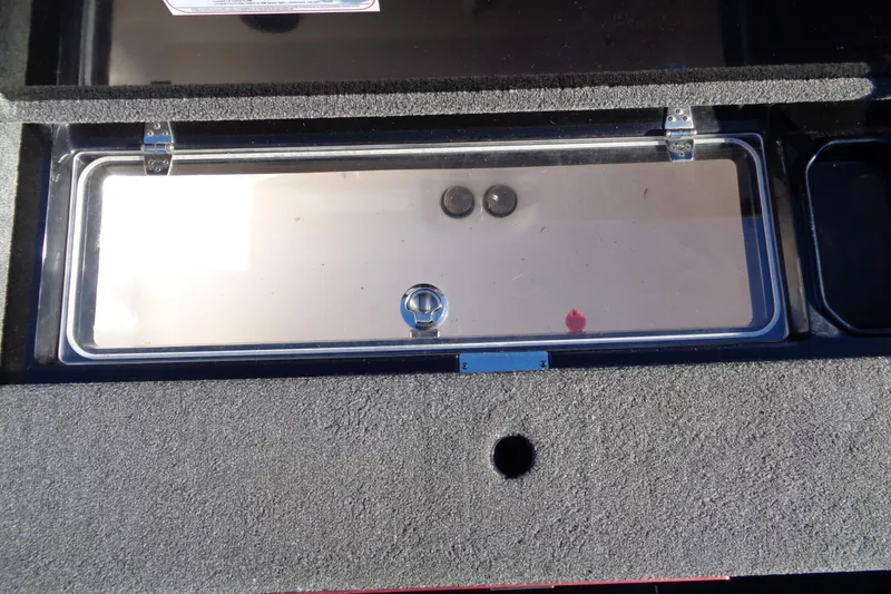 Slide: The Image of 2021 Vexus DVX20 boat storage compartment with secure latch and durable design. - 33