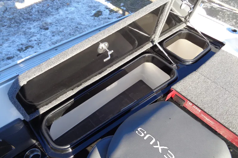 Slide: The Image of 2021 Vexus DVX20 boat storage compartments with open lids, showcasing interior space. - 35
