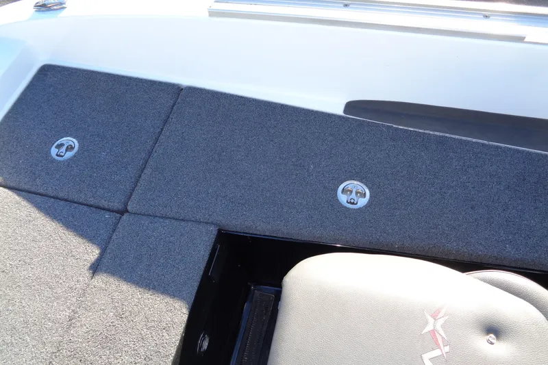 Slide: The Image of 2021 Vexus DVX20 boat deck with carpeted storage compartments and seating. - 36