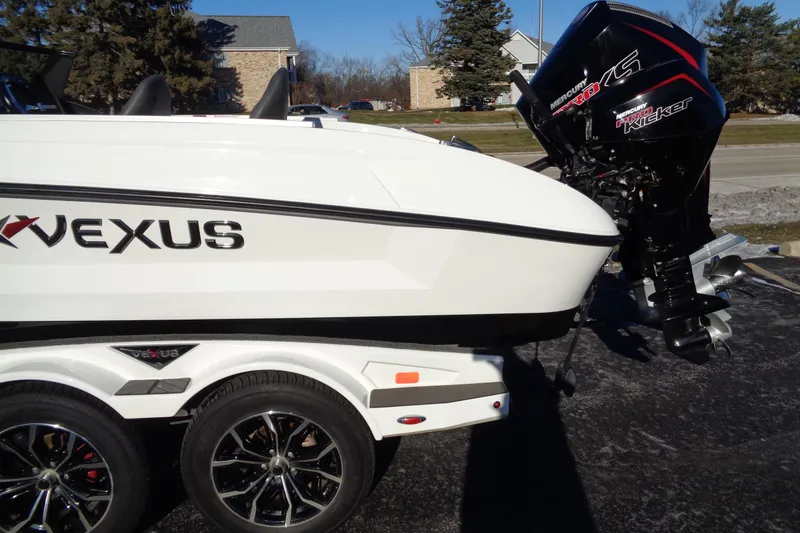 Slide: The Image of 2021 Vexus DVX20 boat with Mercury engine on a dual-axle trailer. - 4