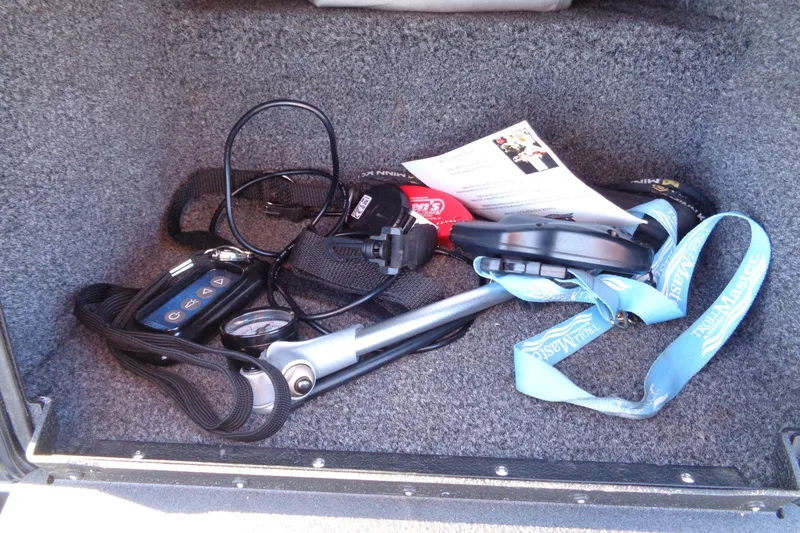 Slide: The Image of Storage compartment in a 2021 Vexus DVX20 boat with various equipment and accessories. - 41