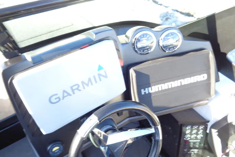 Slide: The Image of 2021 Vexus DVX20 dashboard with Garmin and Humminbird navigation systems. - 43