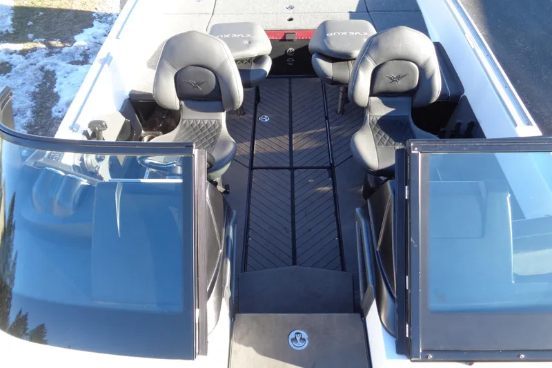 Slide: The Image of 2021 Vexus DVX20 boat interior with black seats and dual windshields. - 46