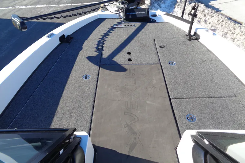 Slide: The Image of 2021 Vexus DVX20 boat deck with storage compartments and trolling motor. - 49