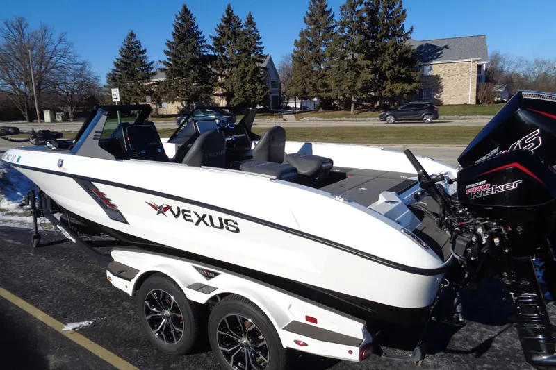 Slide: The Image of 2021 Vexus DVX20 boat on trailer, featuring dual Mercury Pro Kicker engines. - 50