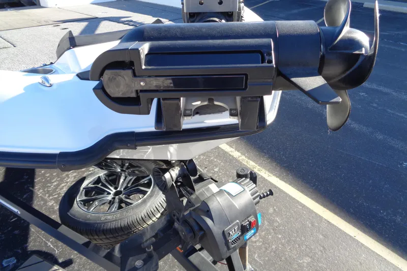 Slide: The Image of 2021 Vexus DVX20 boat motor and propeller close-up in a parking lot. - 9
