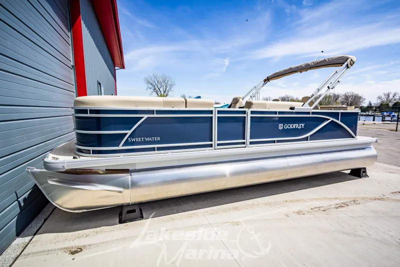 The Image of 2025 Godfrey Sweetwater 2286 FSX pontoon boat docked at marina. - 1