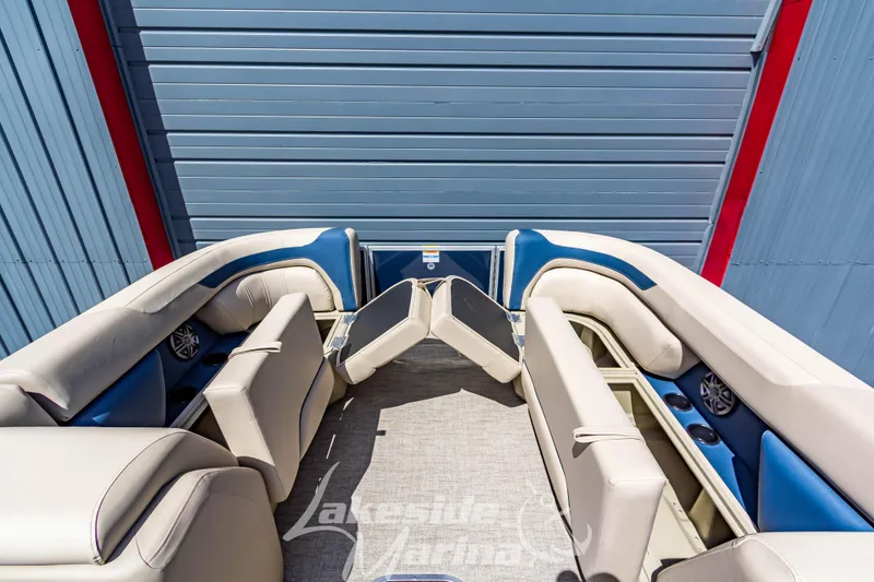 Slide: The Image of 2025 Godfrey Sweetwater 2286 FSX boat interior with beige and blue seating. - 13