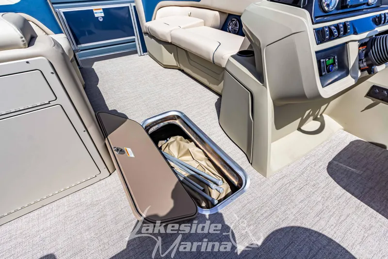 Slide: The Image of Interior of 2025 Godfrey Sweetwater 2286 FSX boat with open storage compartment. - 15