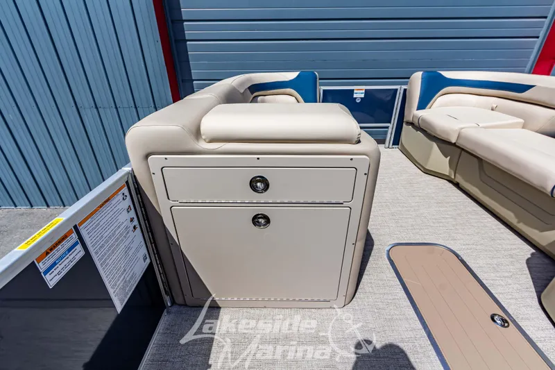 Slide: The Image of 2025 Godfrey Sweetwater 2286 FSX boat interior with beige seating and storage compartments. - 16