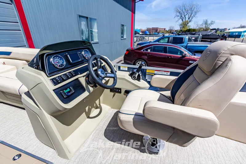 Slide: The Image of 2025 Godfrey Sweetwater 2286 FSX boat interior with steering console and captain's chair. - 19