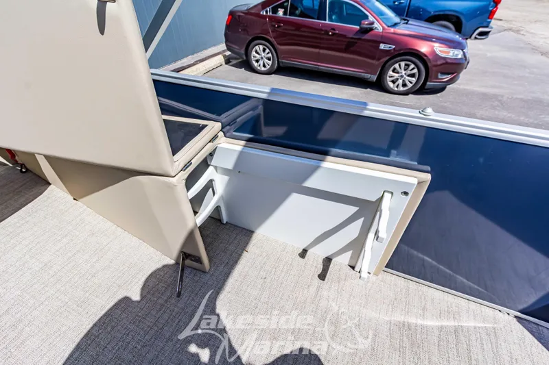 Slide: The Image of 2025 Godfrey Sweetwater 2286 FSX boat interior with seating and storage. - 27